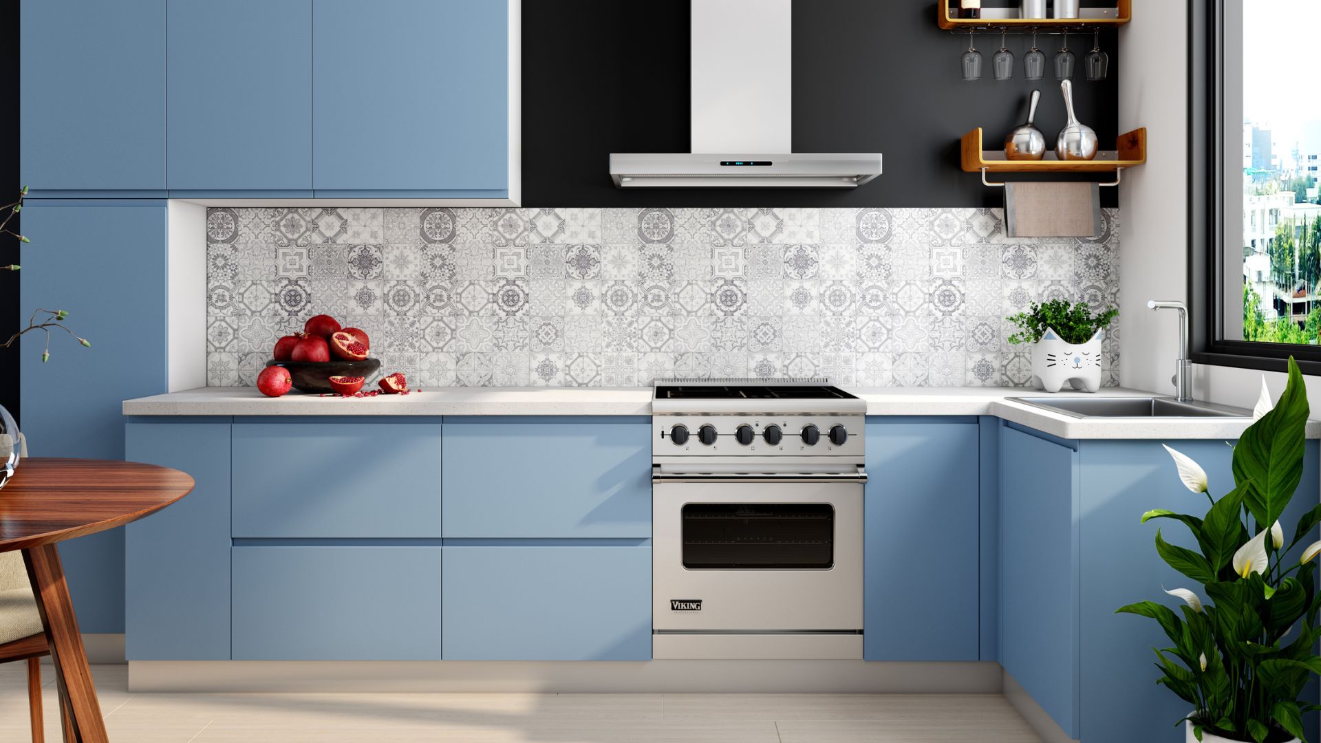 A modern kitchen with blue cabinets, patterned backsplash tiles, and a stainless steel oven, decorated with fresh pomegranates and plants.